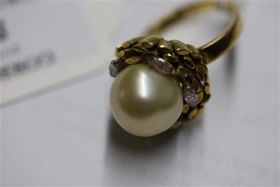 An 18ct gold, diamond and cultured pearl dress ring by John Donald, circa 1970, in modernist setting, size P/Q.